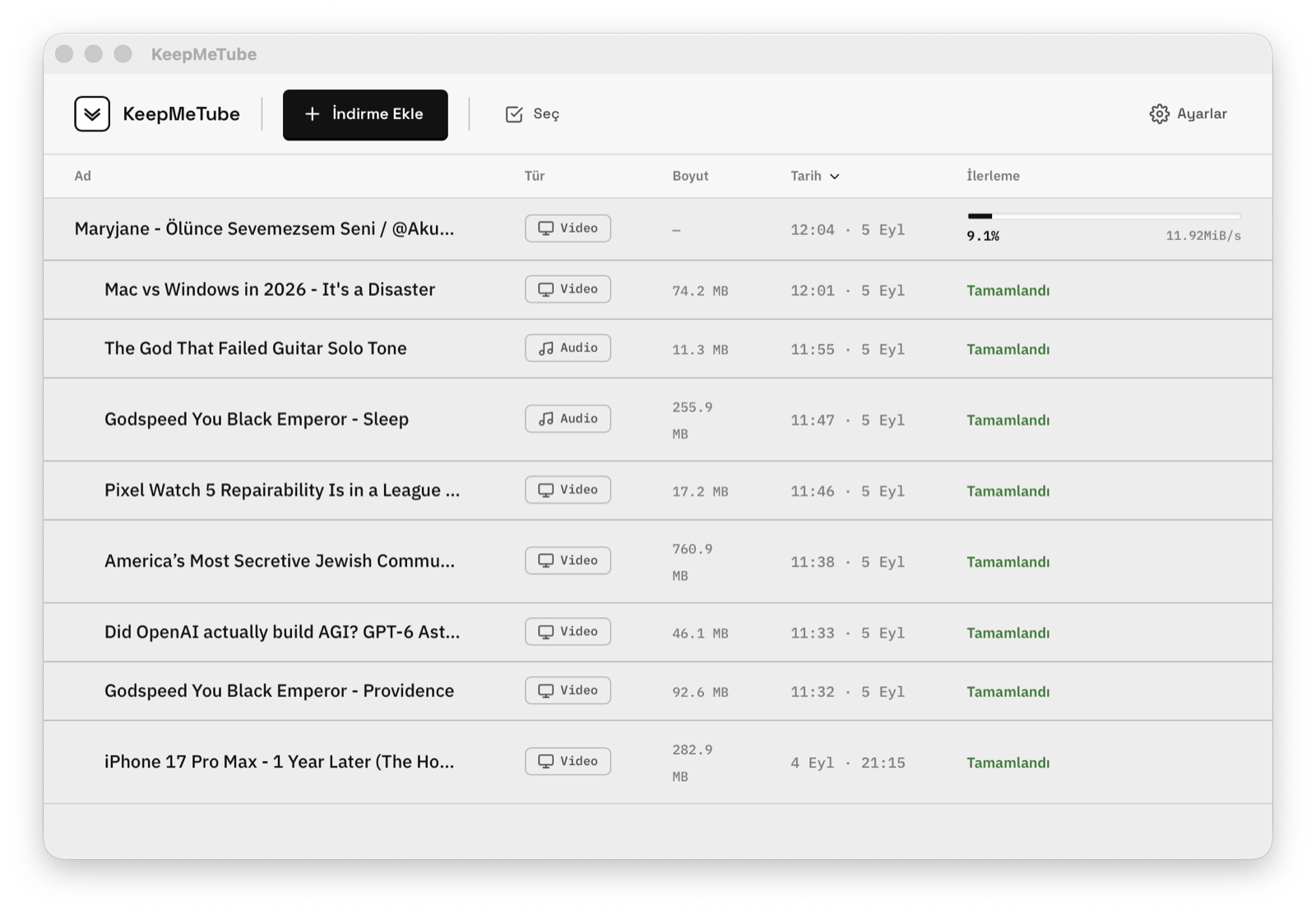 Download list in light mode with an active download at 9.1 percent and a transfer speed of 11.92 MiB per second